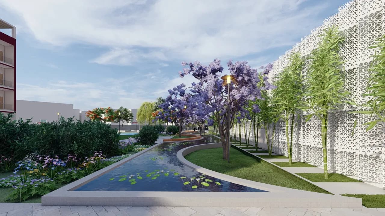 Old Age Home & Orphanage, Noida — landscaped pond with jacaranda trees beside a block